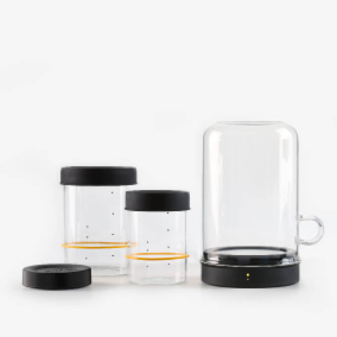 Sourhouse Big Bundle including Goldie starter jar warmer, Cooling Puck, pint and quart glass sourdough starter jars with silicone lids, and USB adapter on white background