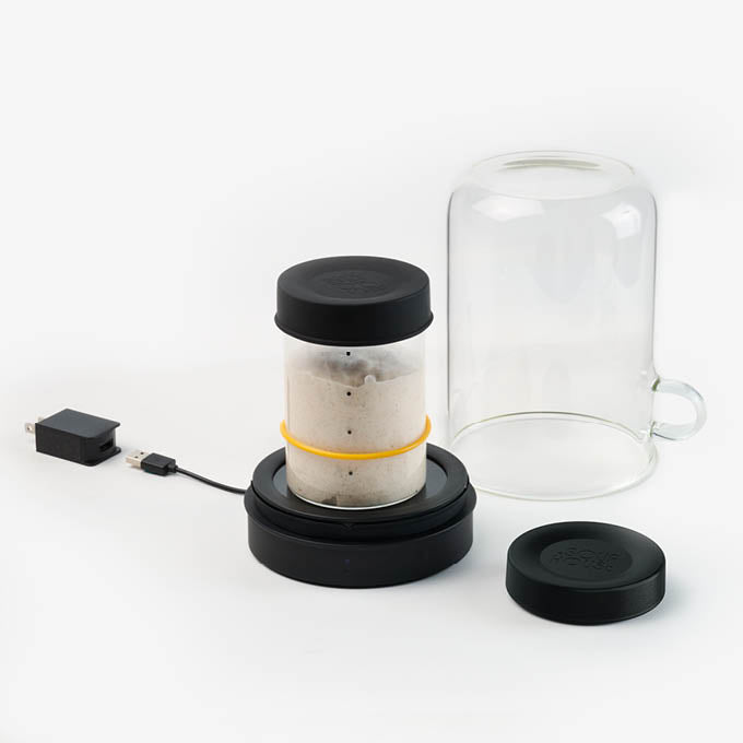 Sourhouse Big Bundle sourdough starter kit with Goldie starter jar warmer and glass sourdough starter jars on kitchen counter